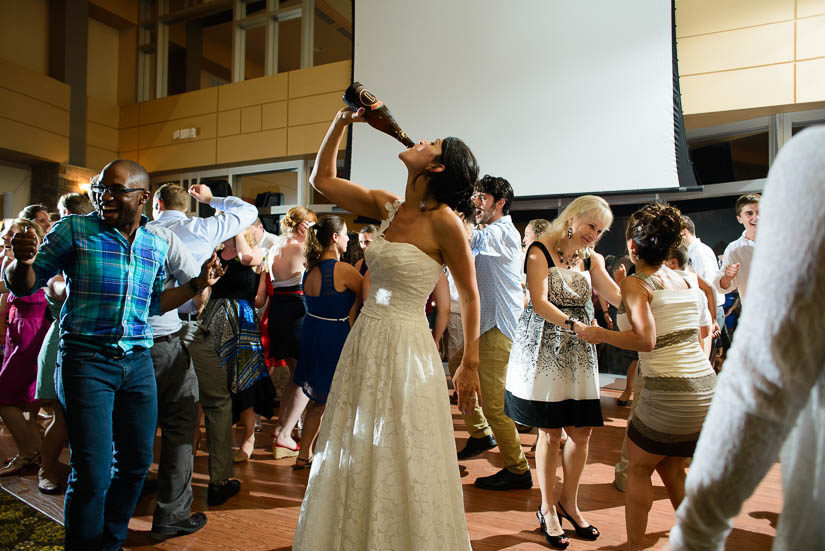 bride drinking on the dancefloor at the woodlands at algonkian wedding