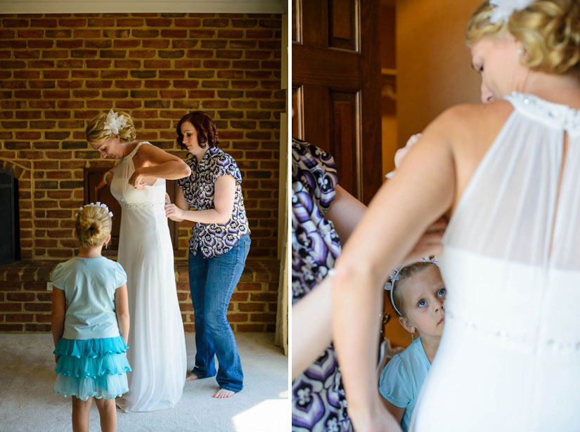 bride putting on her dress at Sunset Crest Manor